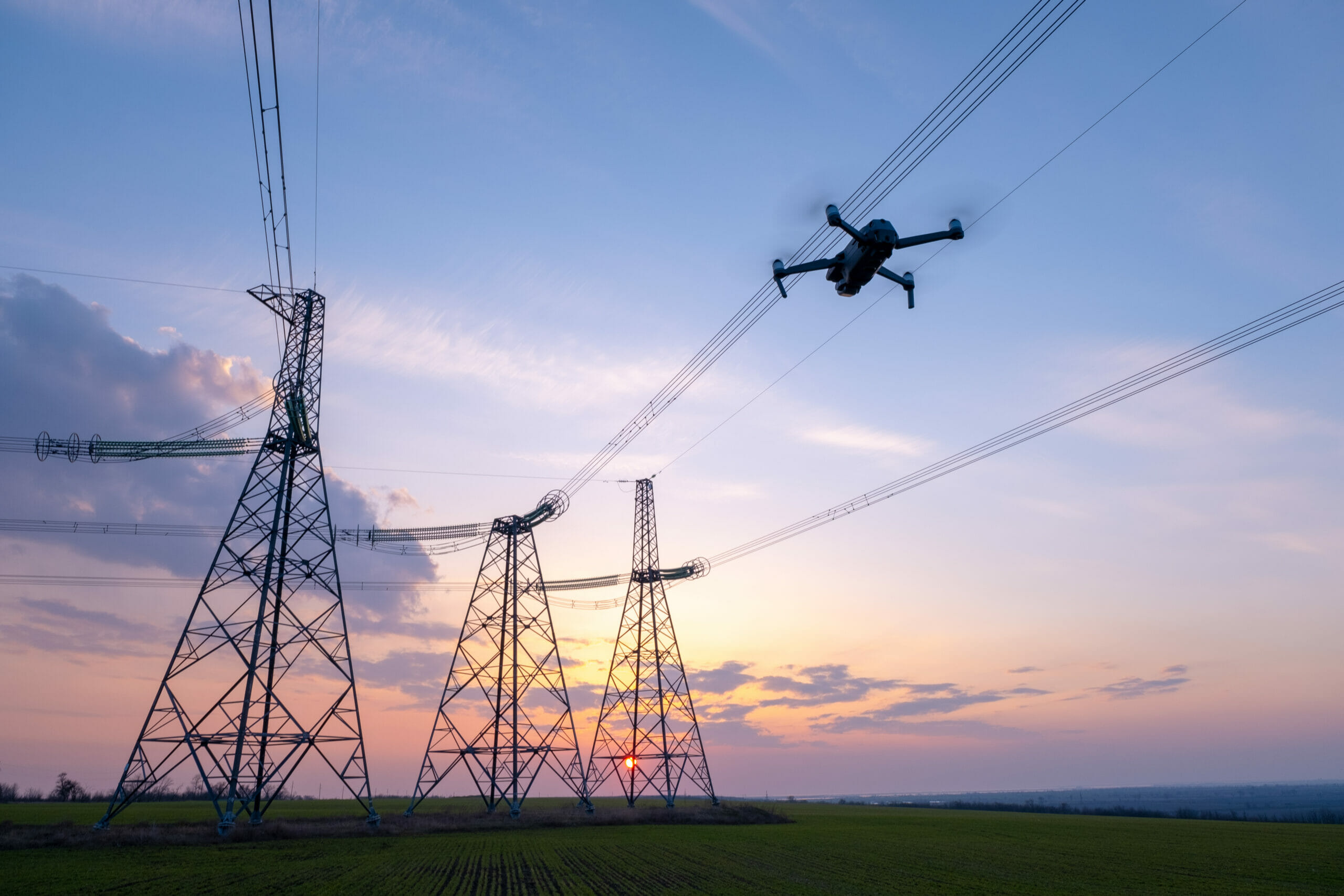 A,Drone,Taking,Pictures,Of,High-voltage,Power,Lines,In,The